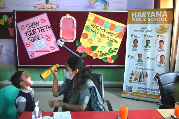 Student receiving care in school routine health checkup